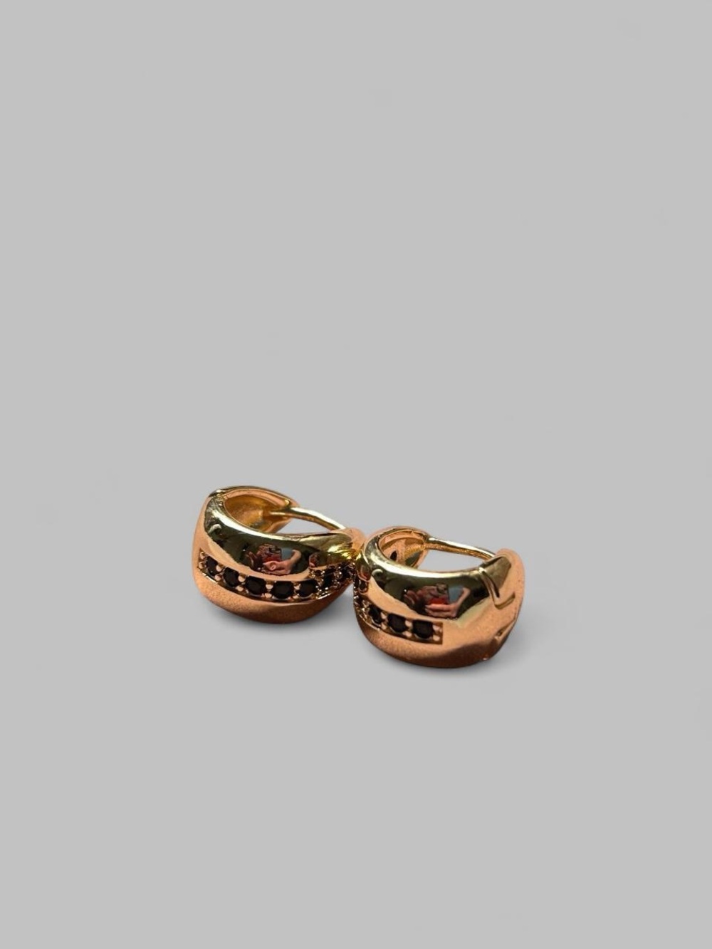 18K gold-filled huggie hoop earrings over brass, with sparkling black CZ stones